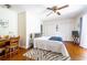 Cozy bedroom with hardwood floors, built-in shelving, and a writing desk at 272 Old Ashley Loop, Pawleys Island, SC 29585