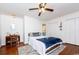 Well-lit bedroom with hardwood floors, a zebra patterned rug, and ample closet space at 272 Old Ashley Loop, Pawleys Island, SC 29585
