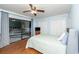 Bright bedroom with hardwood floors, sliding glass doors to patio, and ceiling fan at 272 Old Ashley Loop, Pawleys Island, SC 29585