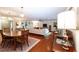 Dining room with oval table, hardwood floors, and green accent wall at 272 Old Ashley Loop, Pawleys Island, SC 29585