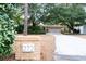 Brick home with a large driveway and mature landscaping at 272 Old Ashley Loop, Pawleys Island, SC 29585