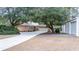 House exterior with long driveway and detached garage at 272 Old Ashley Loop, Pawleys Island, SC 29585