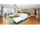 Bright living room featuring an L-shaped sofa and hardwood floors at 272 Old Ashley Loop, Pawleys Island, SC 29585