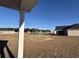 Scenic backyard view of a pond and neighboring homes from the covered patio at 301 Palmetto Sand Loop, Conway, SC 29527