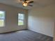 Bright bedroom with two windows and plush carpeting at 301 Palmetto Sand Loop, Conway, SC 29527