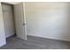 Neutral carpeted bedroom with walk-in closet featuring wire shelving and crisp white trim and walls at 301 Palmetto Sand Loop, Conway, SC 29527
