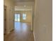 Hallway view leading to an open-concept living area, showcasing the home's layout and modern finishes at 301 Palmetto Sand Loop, Conway, SC 29527