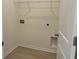 A well-lit laundry room with connections and storage for efficient chores at 301 Palmetto Sand Loop, Conway, SC 29527