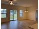 Living room boasts natural light with access to outdoor porch and modern ceiling fan at 301 Palmetto Sand Loop, Conway, SC 29527