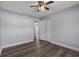 This bedroom has wood-look floors, neutral walls, and closet with views of the home's exterior at 4502 Boxwood St., Myrtle Beach, SC 29577