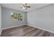 Cozy bedroom with hardwood floors and a bright window overlooking the neighborhood at 4502 Boxwood St., Myrtle Beach, SC 29577