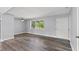 Bright living room with ceiling fan, hardwood floors, and front entry door at 4502 Boxwood St., Myrtle Beach, SC 29577
