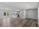 Open-concept living room with hardwood floors connecting to a modern kitchen at 4502 Boxwood St., Myrtle Beach, SC 29577