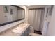 Bathroom with large mirror, granite countertop and shower with crisp white towels at 4719 S Ocean Blvd. # 609, North Myrtle Beach, SC 29582