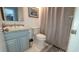 Bright bathroom with grey vanity, granite countertop, and shower curtain in modern home at 4719 S Ocean Blvd. # 609, North Myrtle Beach, SC 29582