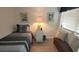 Charming bedroom with a twin bed, nautical themed artwork, and comfortable seating at 4719 S Ocean Blvd. # 609, North Myrtle Beach, SC 29582