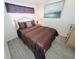 Comfortable bedroom with queen bed, wooden bed frame, and neutral-toned bedding at 4719 S Ocean Blvd. # 609, North Myrtle Beach, SC 29582