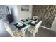 Dining area with glass-top table, seating for four, and coastal-themed decor at 4719 S Ocean Blvd. # 609, North Myrtle Beach, SC 29582