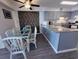 Bright kitchen with granite countertops, modern appliances, and adjacent dining area at 4719 S Ocean Blvd. # 609, North Myrtle Beach, SC 29582
