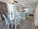 Open floor plan featuring a kitchen, dining room with seating for six, and ocean views at 4719 S Ocean Blvd. # 609, North Myrtle Beach, SC 29582