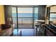 Cozy living room featuring stylish furnishings and access to a balcony with stunning ocean views at 4719 S Ocean Blvd. # 609, North Myrtle Beach, SC 29582