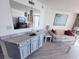 Relaxing living space with wet bar, comfortable sofa, and beach views from the balcony at 4719 S Ocean Blvd. # 609, North Myrtle Beach, SC 29582