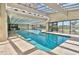 Indoor pool with lots of sunlight and a view to the outside at 4719 S Ocean Blvd. # 609, North Myrtle Beach, SC 29582