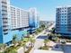 Street view of a beautiful building with Palm trees and blue skies at 4719 S Ocean Blvd. # 609, North Myrtle Beach, SC 29582