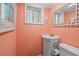 Small bathroom with a sink and toilet, coral decor at 6001 - D07 S Kings Hwy., Myrtle Beach, SC 29575