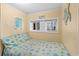 Small bedroom with a twin bed and beach-themed bedding at 6001 - D07 S Kings Hwy., Myrtle Beach, SC 29575