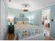 Well-lit bedroom with a queen-size bed and access to another room at 6001 - D07 S Kings Hwy., Myrtle Beach, SC 29575
