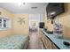 Compact bedroom with a twin bed and view into dining area at 6001 - D07 S Kings Hwy., Myrtle Beach, SC 29575