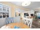 Kitchen and dining area with a wood table and white chairs at 6001 - D07 S Kings Hwy., Myrtle Beach, SC 29575