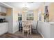 Small dining area with a round table and four chairs at 6001 - D07 S Kings Hwy., Myrtle Beach, SC 29575