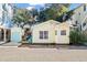 Inviting yellow cottage features a deck and nicely landscaped yard at 6001 - D07 S Kings Hwy., Myrtle Beach, SC 29575
