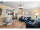 Open living room with kitchen view, hardwood floors, and comfy seating at 6001 - D07 S Kings Hwy., Myrtle Beach, SC 29575