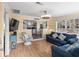 Bright living room with comfy sofas, a large TV and open concept kitchen at 6001 - D07 S Kings Hwy., Myrtle Beach, SC 29575