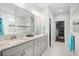 Bathroom with a double vanity, marble floors, and access to a walk-in closet at 6550 Anterselva Dr., Myrtle Beach, SC 29572