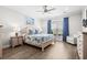 Bright bedroom with hardwood floors, a ceiling fan, and views of the landscape at 6550 Anterselva Dr., Myrtle Beach, SC 29572