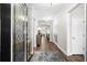 Inviting hallway showcasing hardwood floors, a decorative front door, and neutral walls at 6550 Anterselva Dr., Myrtle Beach, SC 29572