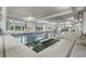 Bright indoor community pool with large windows and clearly marked lanes for swimming at 6550 Anterselva Dr., Myrtle Beach, SC 29572