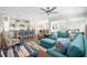 Bright living room with an open-concept layout featuring hardwood floors, comfortable seating and modern decor at 6550 Anterselva Dr., Myrtle Beach, SC 29572