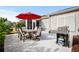 Back patio featuring outdoor grill and dining set, perfect for entertaining friends and Gathering at 6550 Anterselva Dr., Myrtle Beach, SC 29572