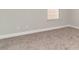 This bedroom offers plush carpeting, a bright window, and neutral walls at 1106 Barrington Way, Conway, SC 29526