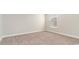 Bright bedroom showing the neutral walls and carpet and a window at 1106 Barrington Way, Conway, SC 29526
