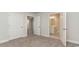 Bright bedroom featuring neutral walls, carpet, and access to a bathroom and hallway at 1106 Barrington Way, Conway, SC 29526