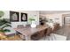 Farmhouse-style dining room with a large wooden table and wicker chairs at 179 Calm Dr., Little River, SC 29566
