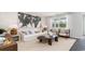Living room with white couch, wood coffee table, and large artwork at 179 Calm Dr., Little River, SC 29566