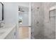 Modern bathroom featuring a luxurious tiled shower and stylish vanity at 2302 Seaseeker Ln., Myrtle Beach, SC 29577