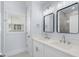 Bathroom with double sinks, modern fixtures, and a window for natural light at 2302 Seaseeker Ln., Myrtle Beach, SC 29577